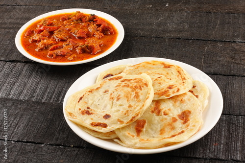 Whole wheat Indian paratha with meat curry 