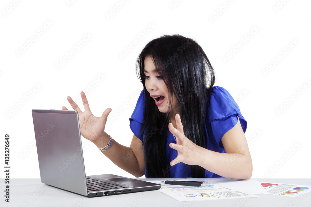 Surprised female worker with laptop Surprised female worker with laptop