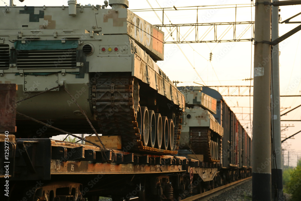 Naklejka premium A freight train carries military equipment