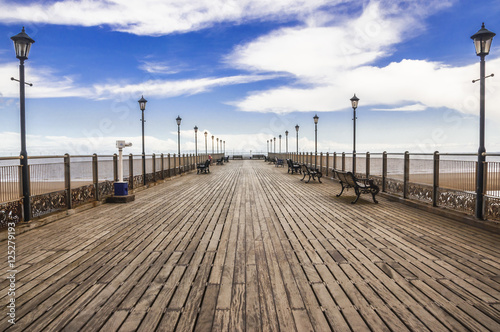 Фотография Wooden Skegness pier heading to the sea in the UK