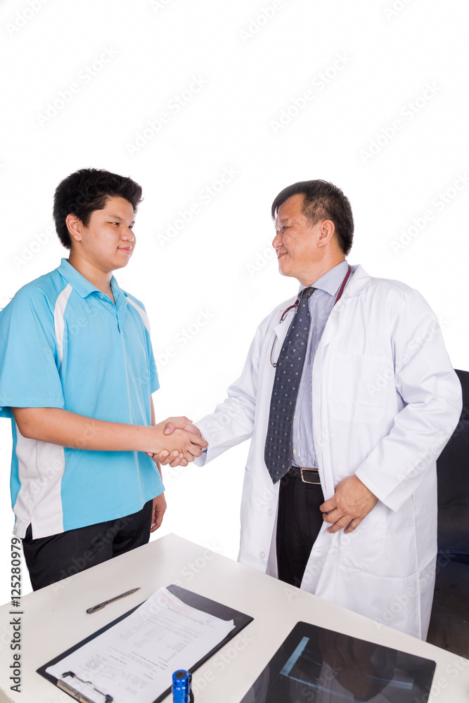 Fototapeta premium Asian patient thank and shakes hand with medical doctor