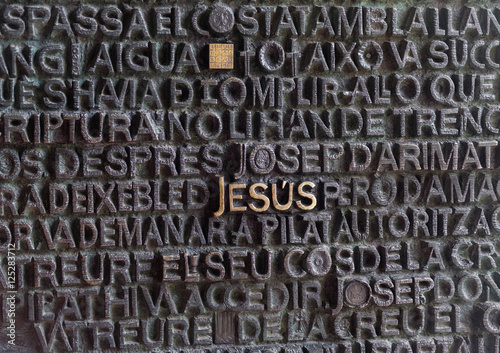 Barcelona, Spain Sagrada Familia door entrance. Jesus written in golden among other letters on the door entrance obf Sagrada Familia. 