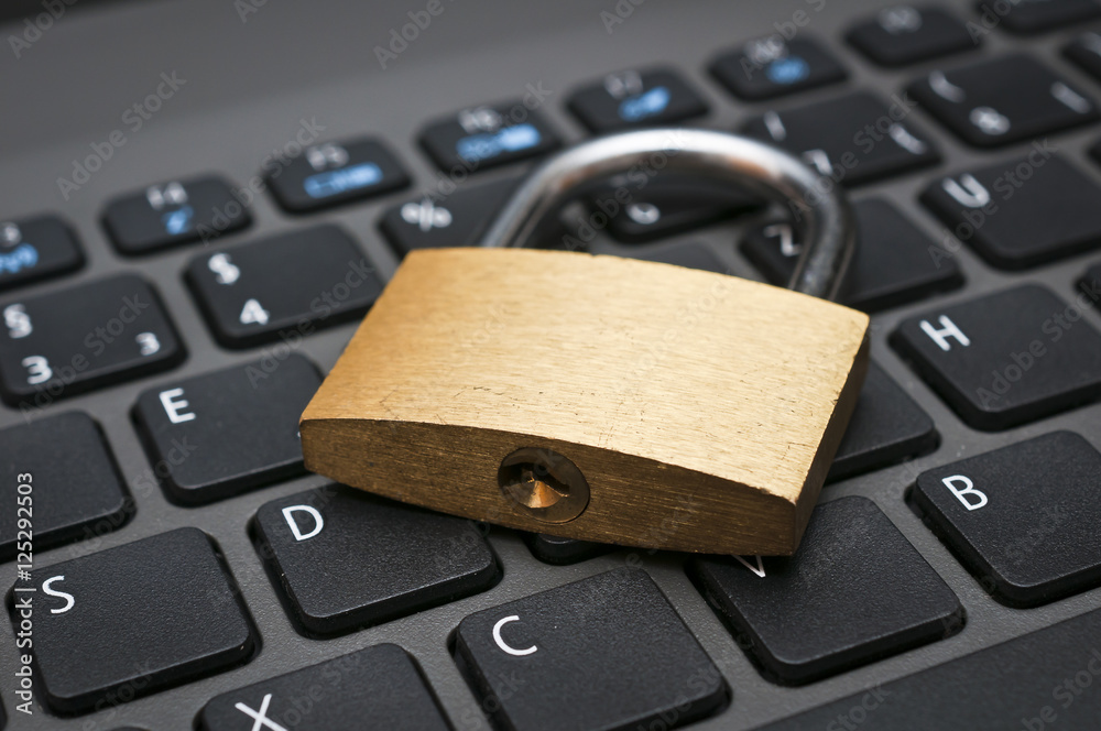Cyber safety concept - lock on computer keyboard Cyber safety concept - lock on computer keyboard
