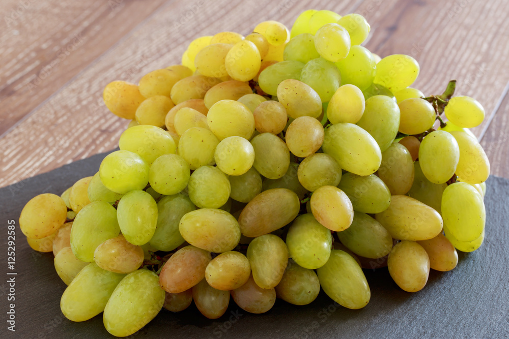 Grapes on a wooden table Grapes on a wooden table