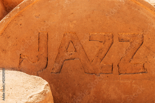 The word Jazz photographed in sand on the beach