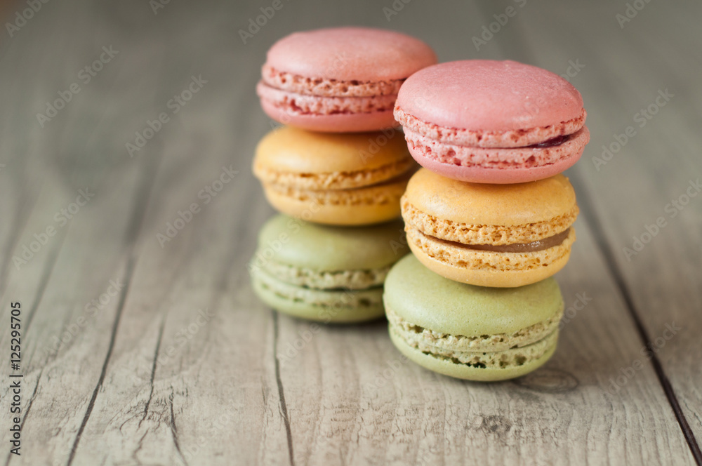 Colorful macaroons over turquoise wood backround Colorful macaroons over turquoise wood backround