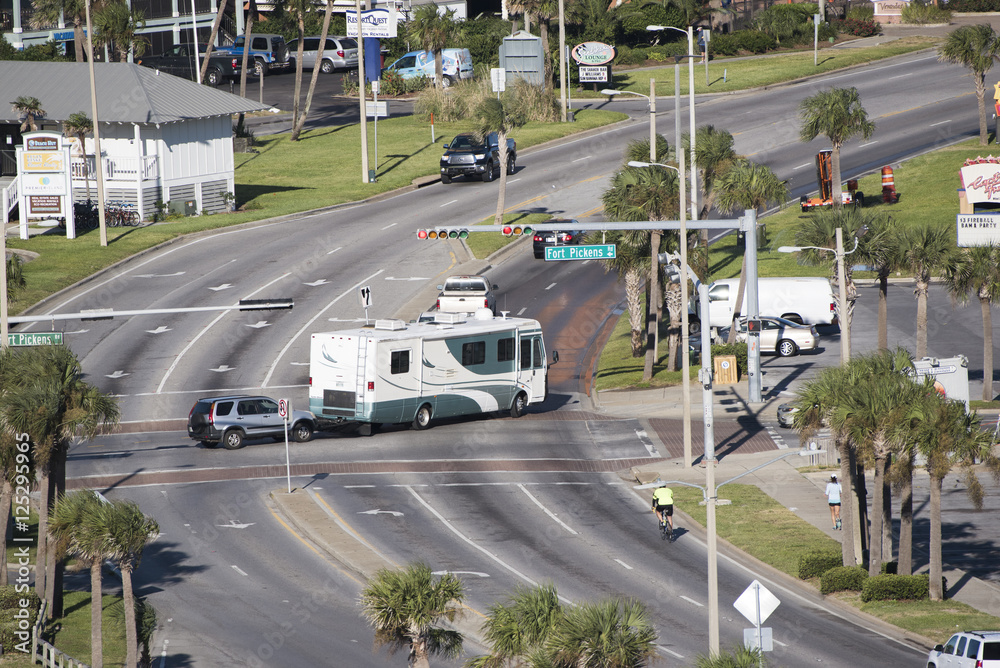 Pensacola Beach Florida USA - October 2016 - Overview of a RV towing a car over a road junction controlled by a traffic light