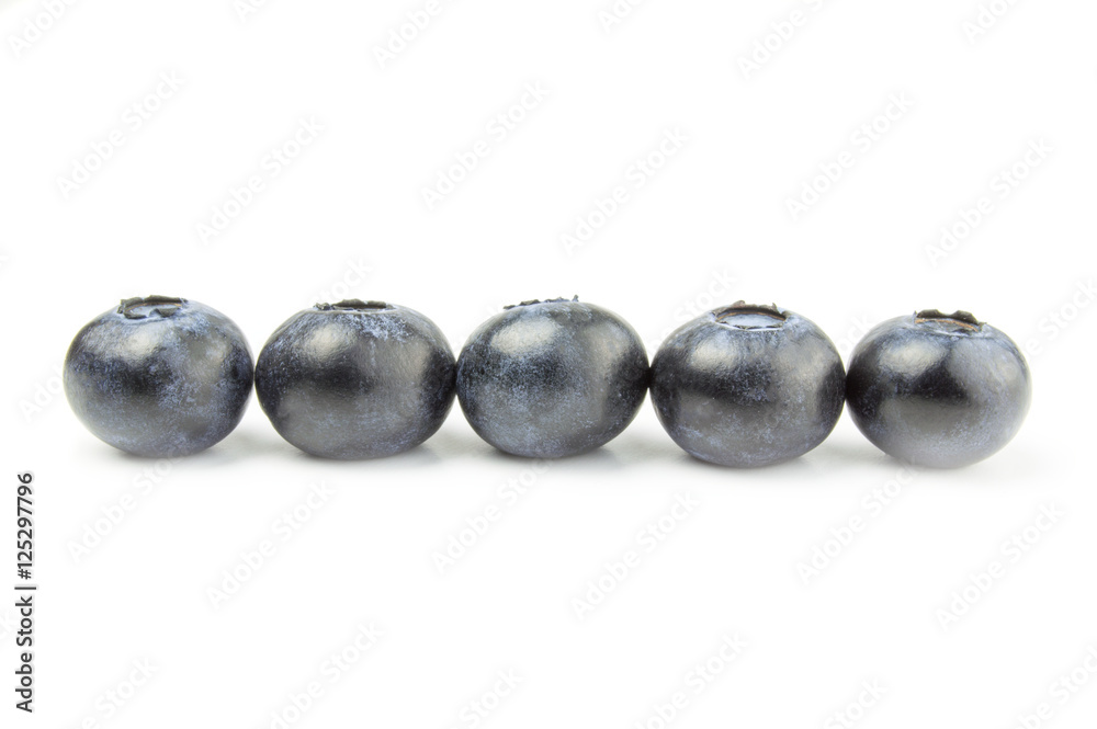 Five fresh blueberries in line isolated on white background Five fresh blueberries in line isolated on white background