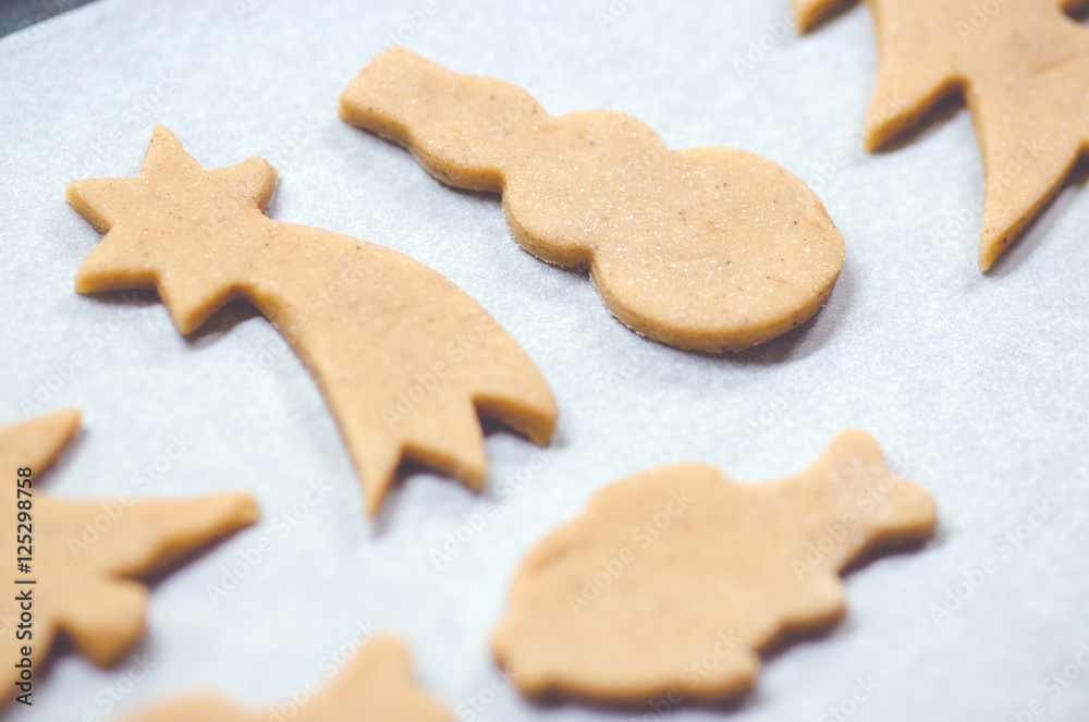 Abstract Christmas food background with cookies molds and flour. Baking Christmas cookies - table, cookie cutters and cookies. Abstract Christmas food background with cookies molds and flour. Baking Christmas cookies - table, cookie cutters and cookies.