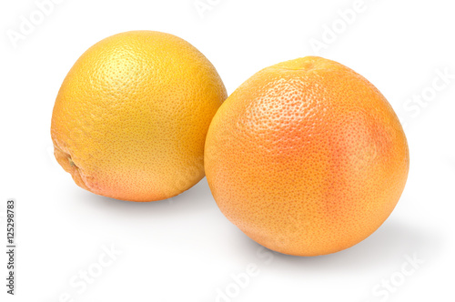 Two ripe grapefruit on white background