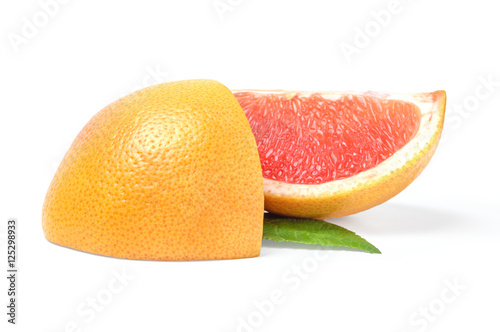 Two slices of grapefruit on white background