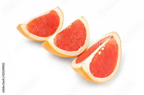 Fresh grapefruit wedge isolated on a white background