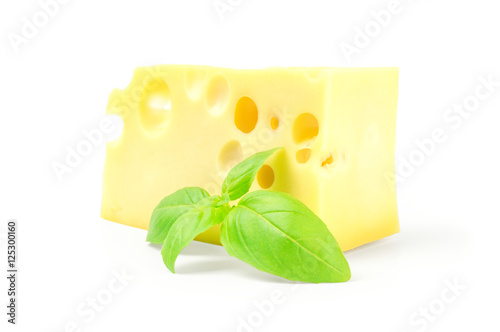 Cheese and basil leaves on a white background