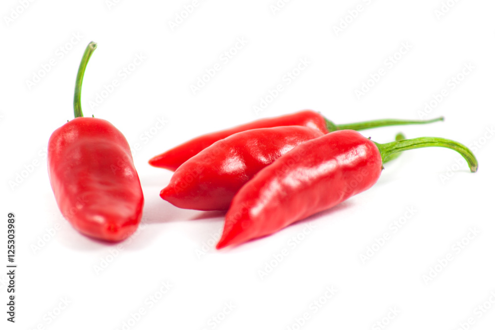 Healthy food. Fresh vegetables. Red peppers on a white backgroun Healthy food. Fresh vegetables. Red peppers on a white backgroun