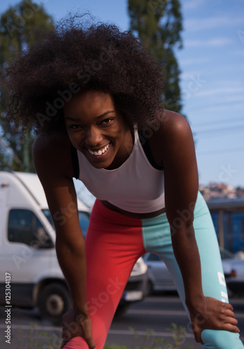 Portrait of sporty young african american woman running outdoors © .shock