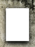 Single blank frame hanged by clips against dirty wall background