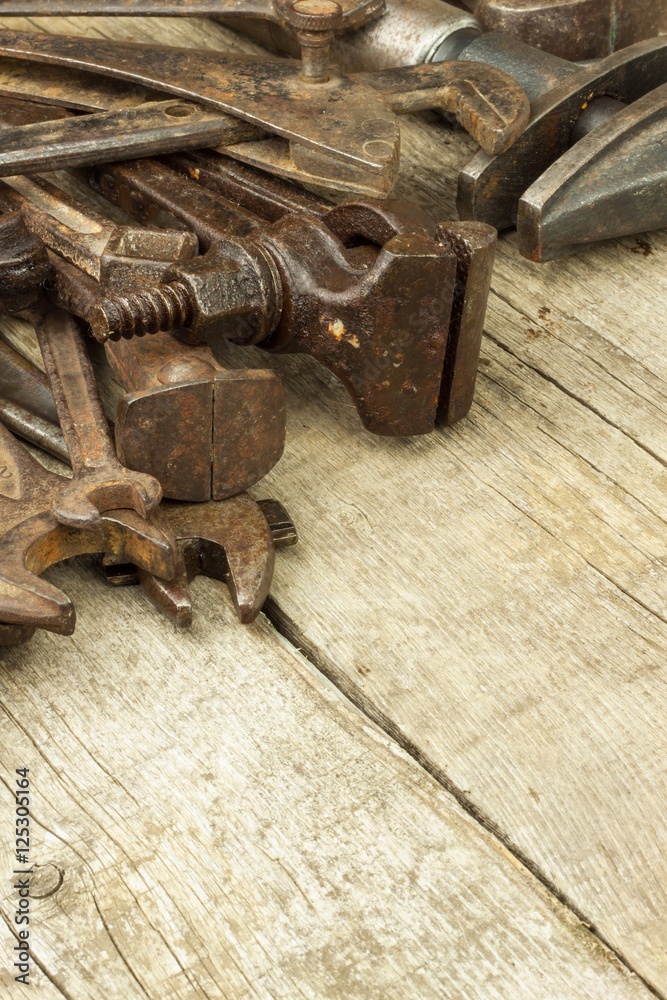 Dirty set of hand tools on a wooden background. Old rusty tools. Equipment for locksmith and metalworking shop. Sales tools for assembly workers. Old shop.
Dirty set of hand tools on a wooden background. Old rusty tools. Equipment for locksmith and metalworking shop. Sales tools for assembly workers. Old shop.