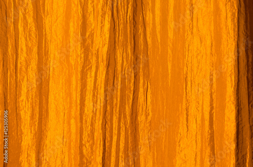 Orange curtain made of crinkled satin