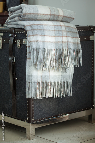 checkered plaid on  vintage trunk