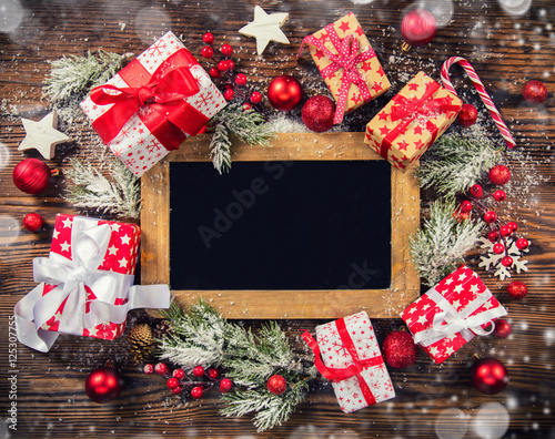 Christmas gift boxes with empty blackboard photo