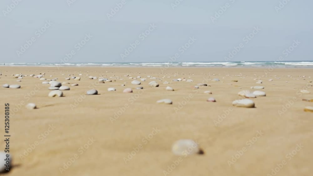 Stones lying on a beach in Morocco. Shot in 4k. Stones lying on a beach in Morocco. Shot in 4k.