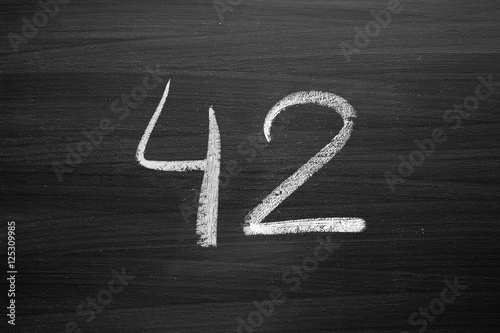 number forty two enumeration written with a chalk on the blackboard