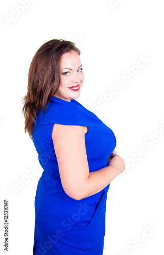 Obraz na plátně Beautiful chubby girl in a blue dress with red lips on a white background