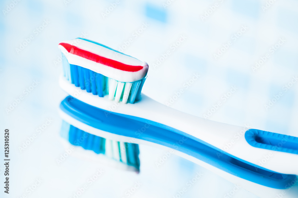 toothbrush with red stripe toothpaste toothbrush with red stripe toothpaste