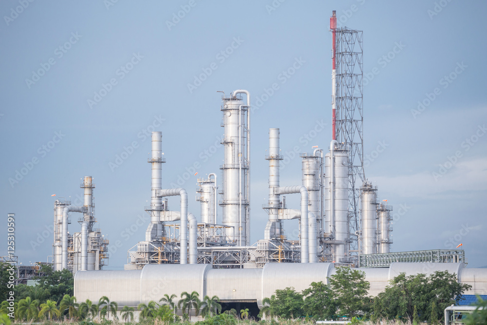 Oil refinery along daytime with blue sky Oil refinery along daytime with blue sky