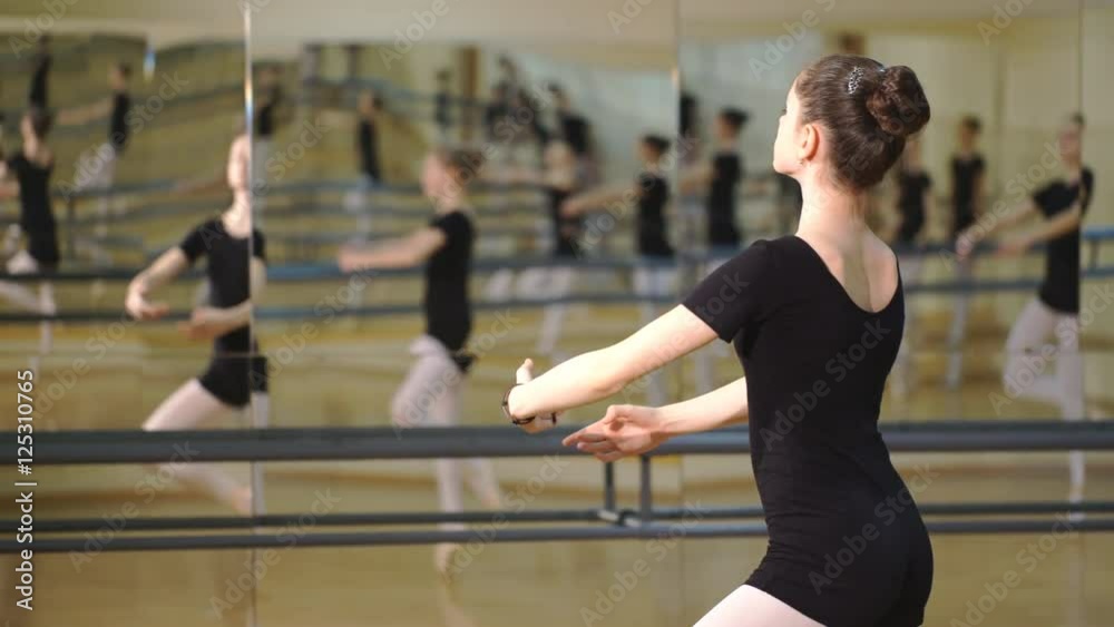 dancer is doing exercises in ballet class dancer is doing exercises in ballet class