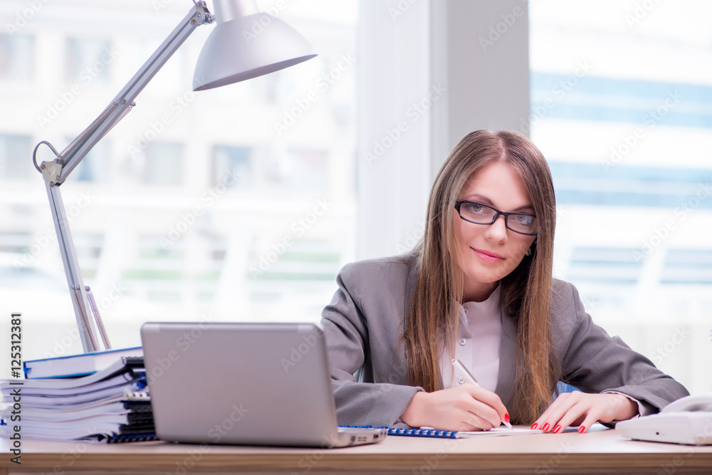 Businesswoman working in the office Businesswoman working in the office