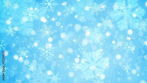 Christmas background of fuzzy and focused snowflakes