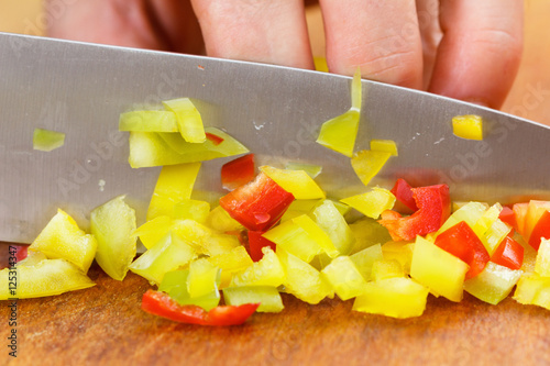 Chef cutting bell pepper fo...