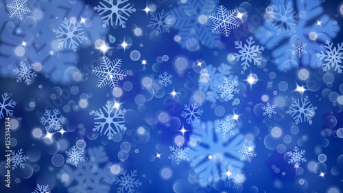 Christmas background of fuzzy and focused snowflakes