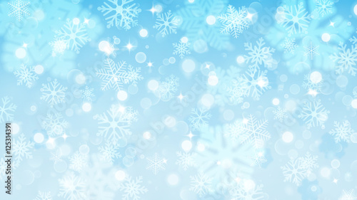 Christmas background of fuzzy and focused snowflakes
