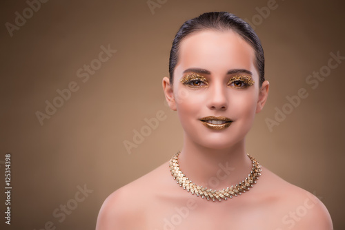 Elegant woman with jewellery in fashion concept