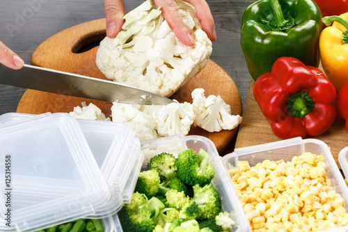 Chef cutting cauliflower fo...