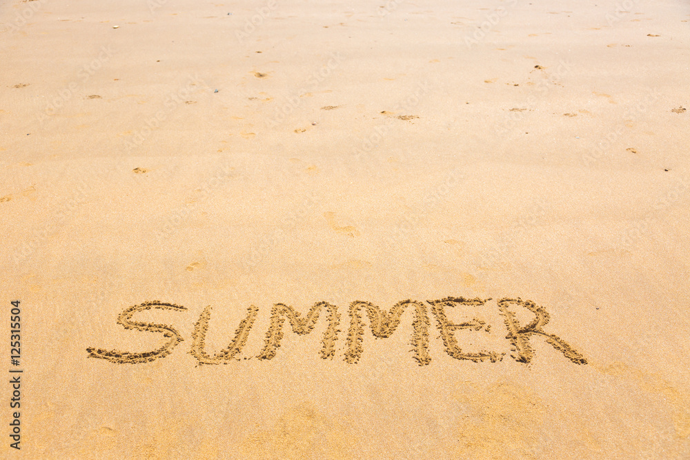 Fototapeta premium Summer word written on sand