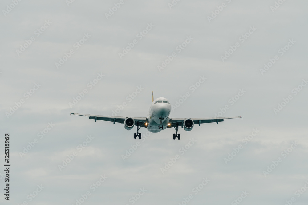 Aircraft landing in cloudy day Aircraft landing in cloudy day