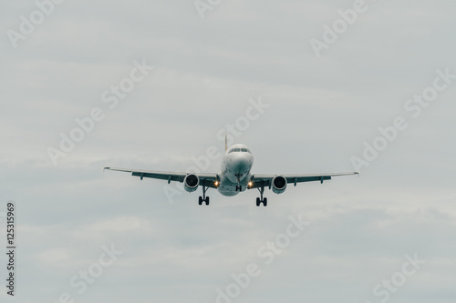 Aircraft landing in cloudy day