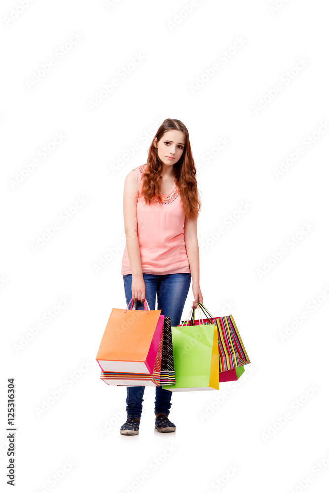 Young woman with shopping bags isolated on white