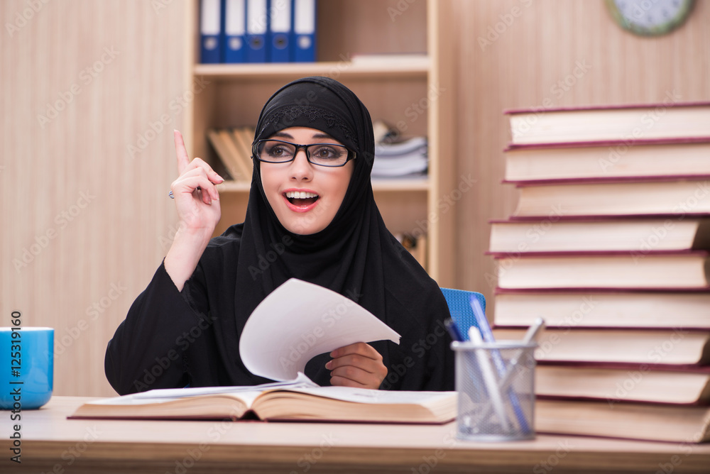 Woman muslim student preparing for exams Woman muslim student preparing for exams