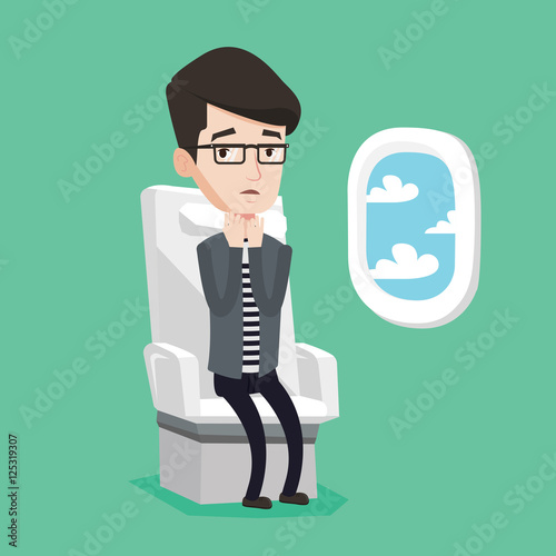 Young man suffering from fear of flying.