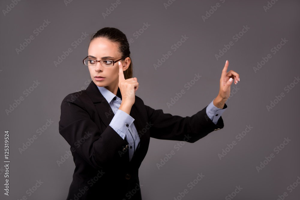 Young woman businesswoman pressing virtual buttons Young woman businesswoman pressing virtual buttons