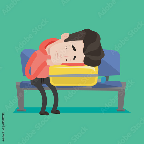 Exhausted man sleeping on suitcase at airport.