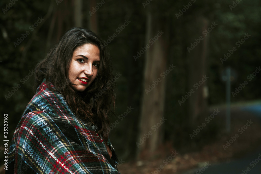 portrait of attractive young woman outdoors in the forest