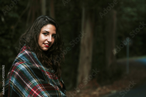 portrait of attractive young woman outdoors in the forest