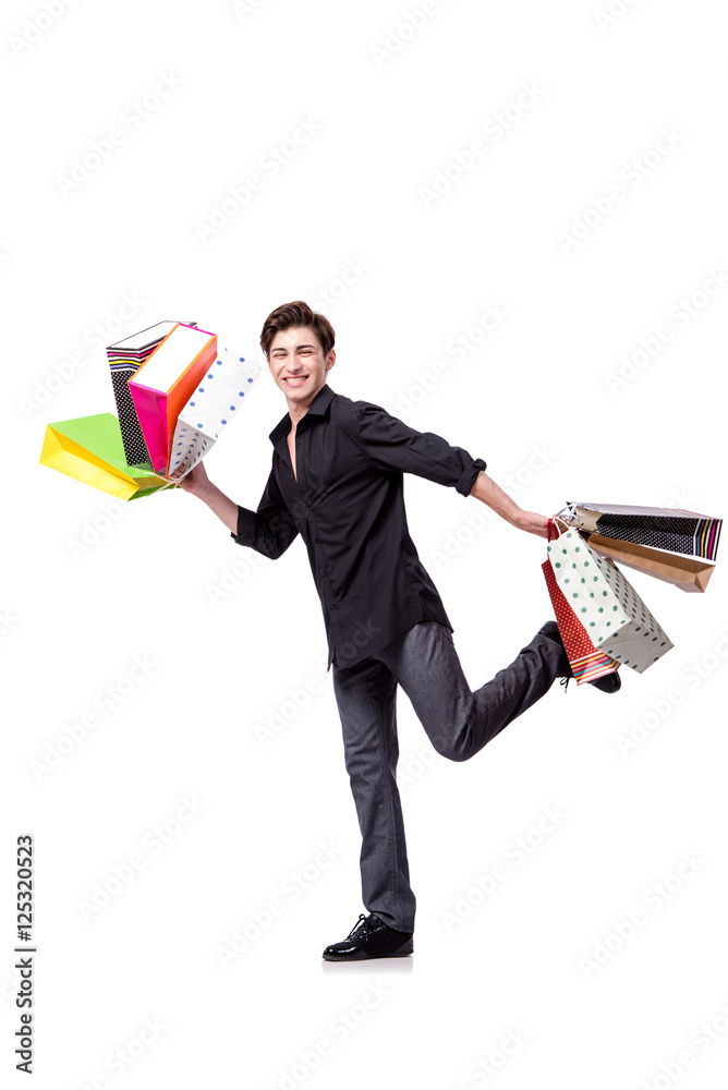 Young man in shopping concept isolated on white Young man in shopping concept isolated on white
