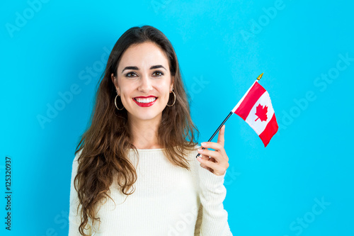 Young woman holding Canadian flag