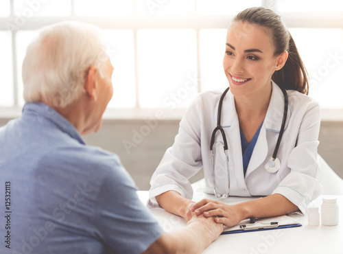 Beautiful doctor and patient photo